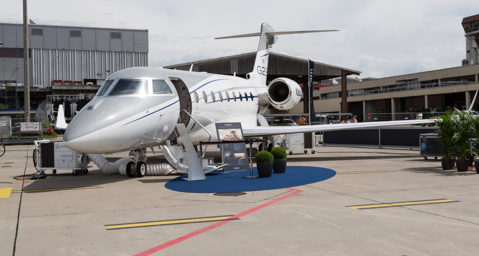 Gulfstream G280 business jet on a ramp at a business aviation show