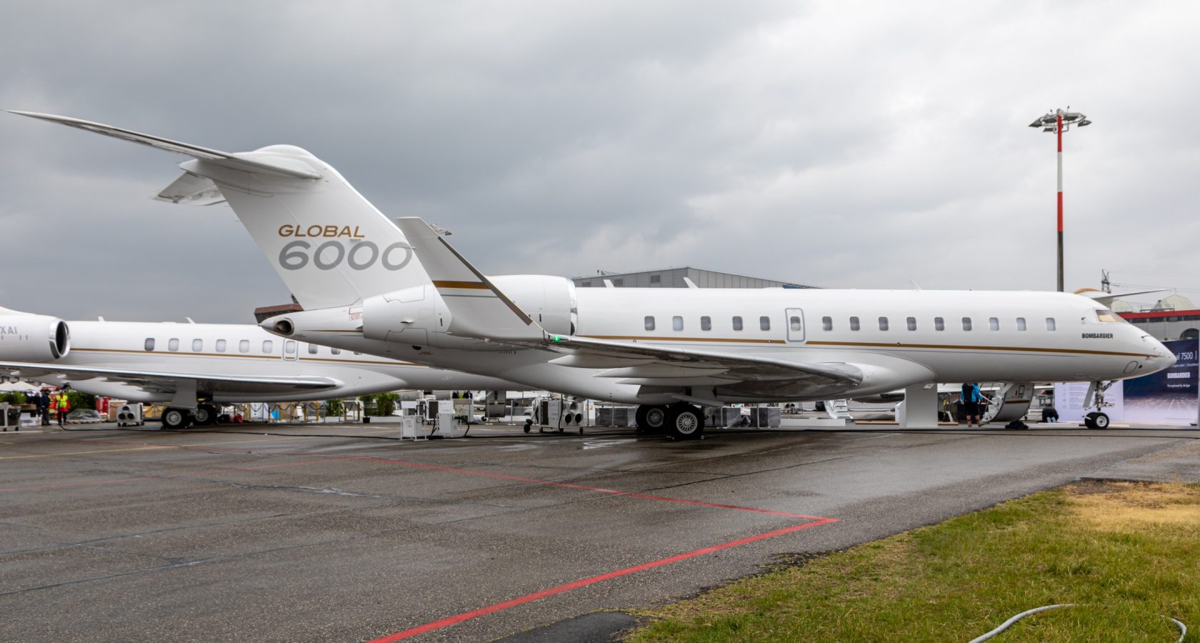 Bombardier Global 6000 heavy business jet on a ramp at a business aviation show