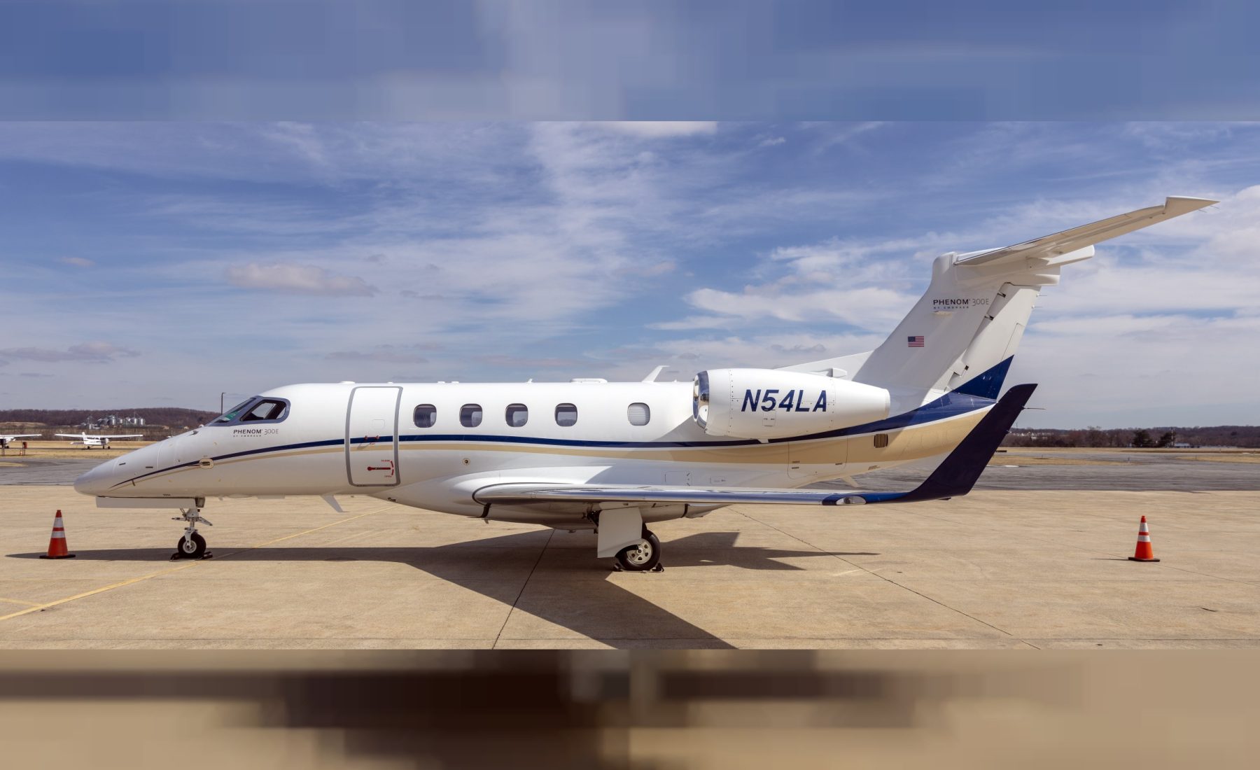 Embraer Phenom 300E parked on ramp at Frederick Municipal Airport